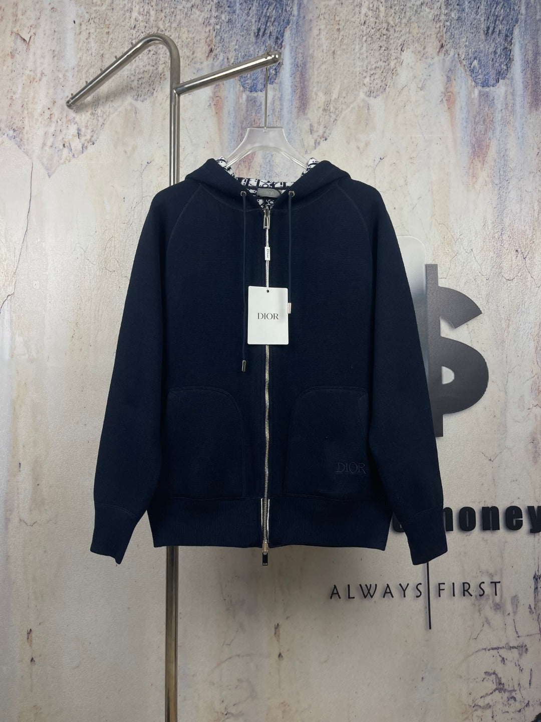 Navy zip-up hooded jacket with drawstring hood and front zipper