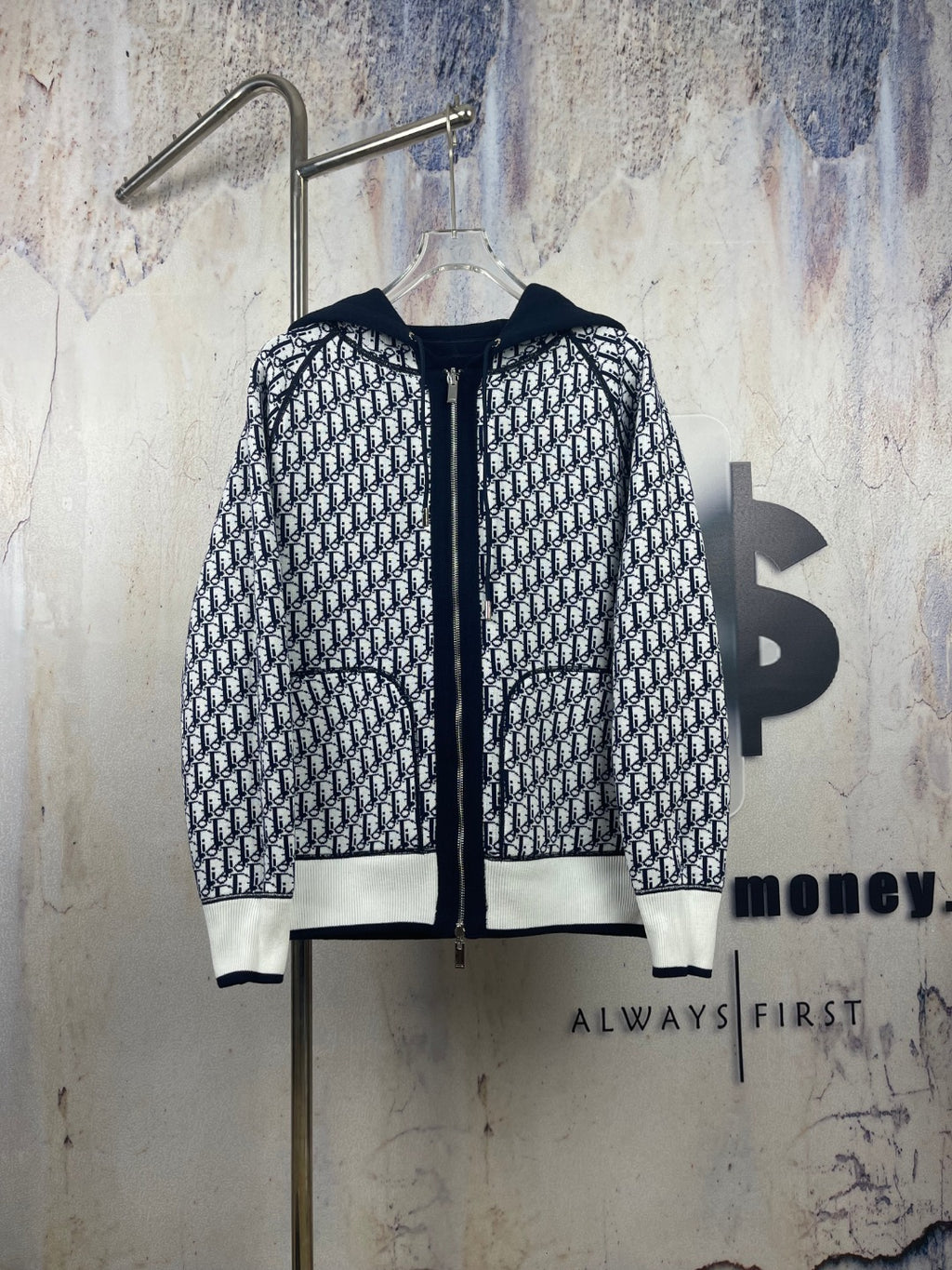 Black-and-white patterned zip-up hooded jacket with drawstring hood