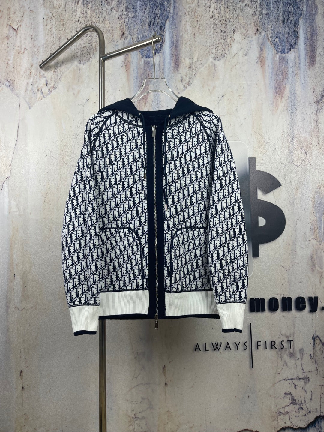 Black-and-white patterned zip-up hooded jacket with drawstring hood