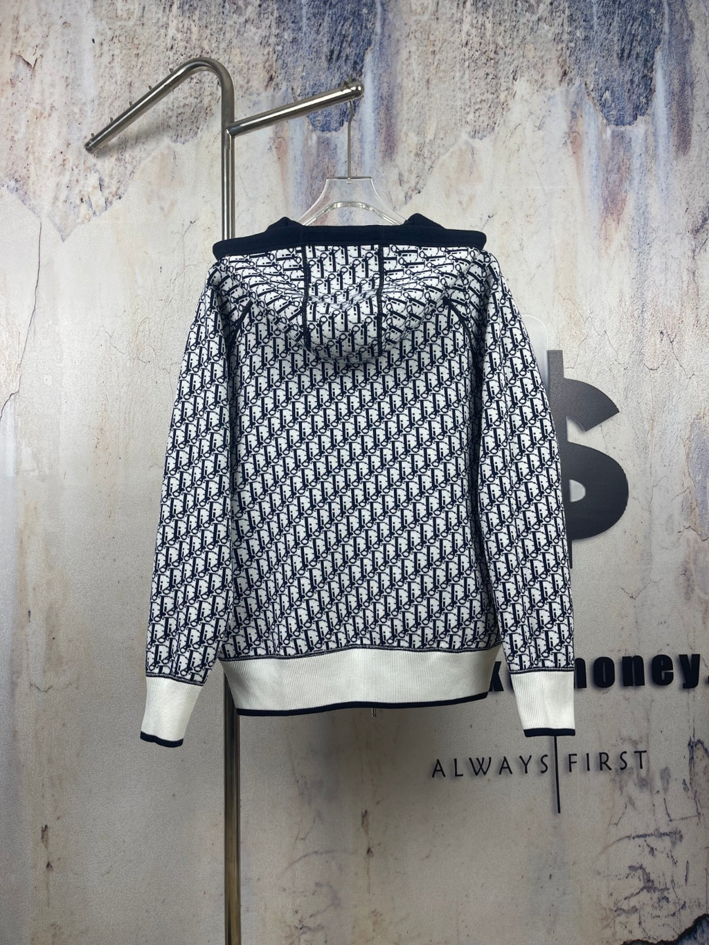 Black-and-white patterned zip-up hooded jacket, back view