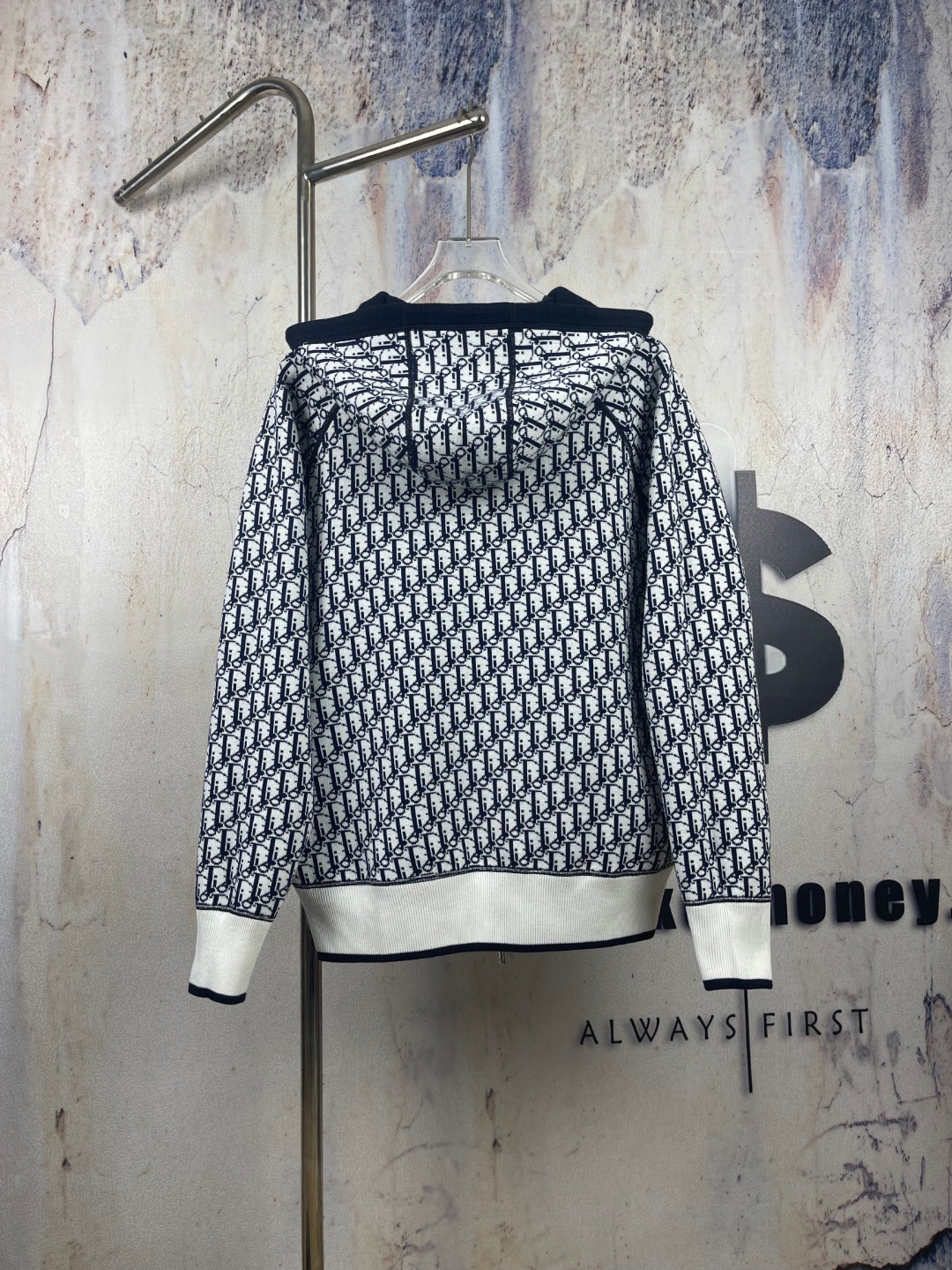 Black-and-white patterned zip-up hooded jacket, back view