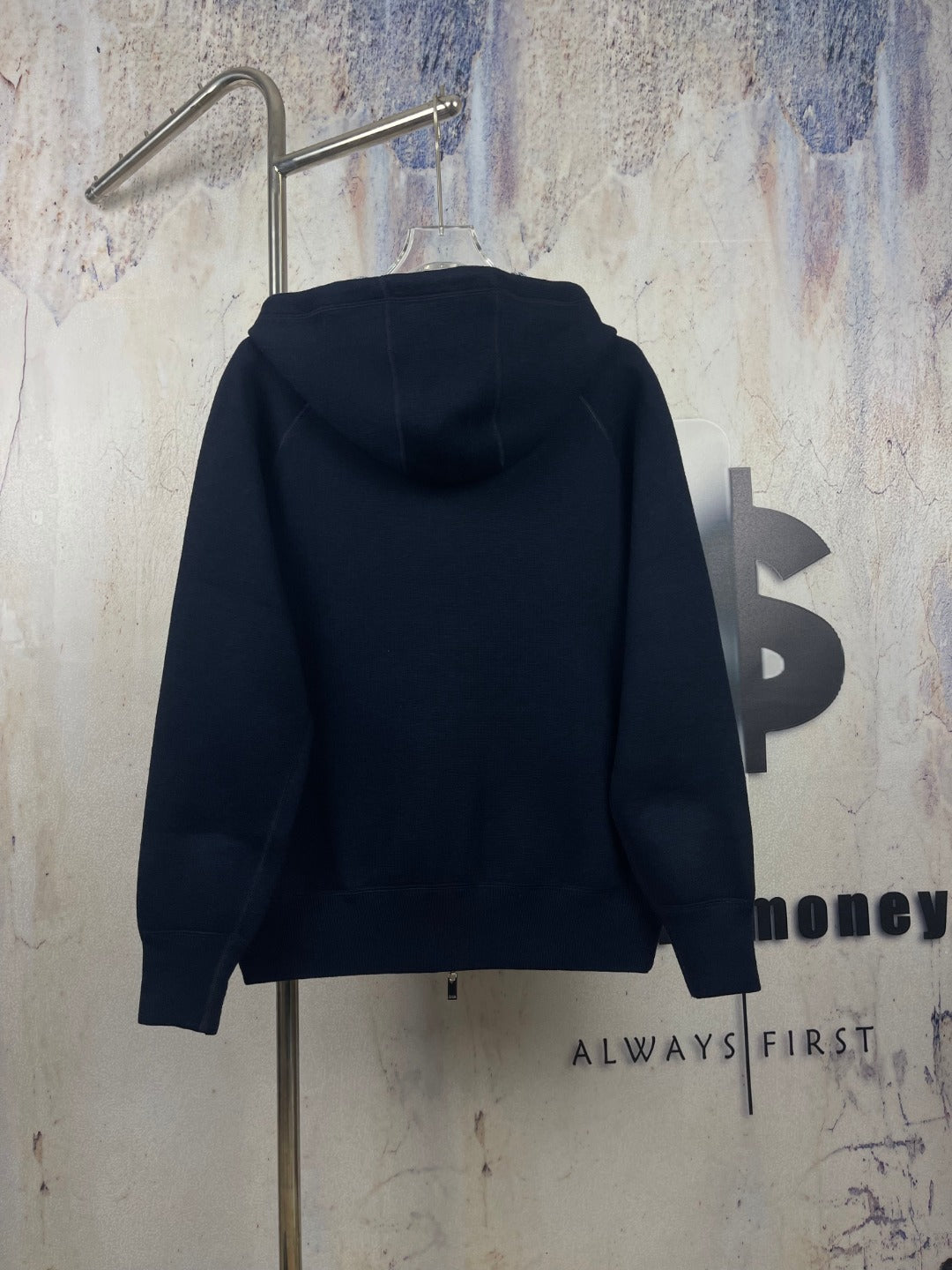 Navy zip-up hooded jacket, back view with full-length zipper
