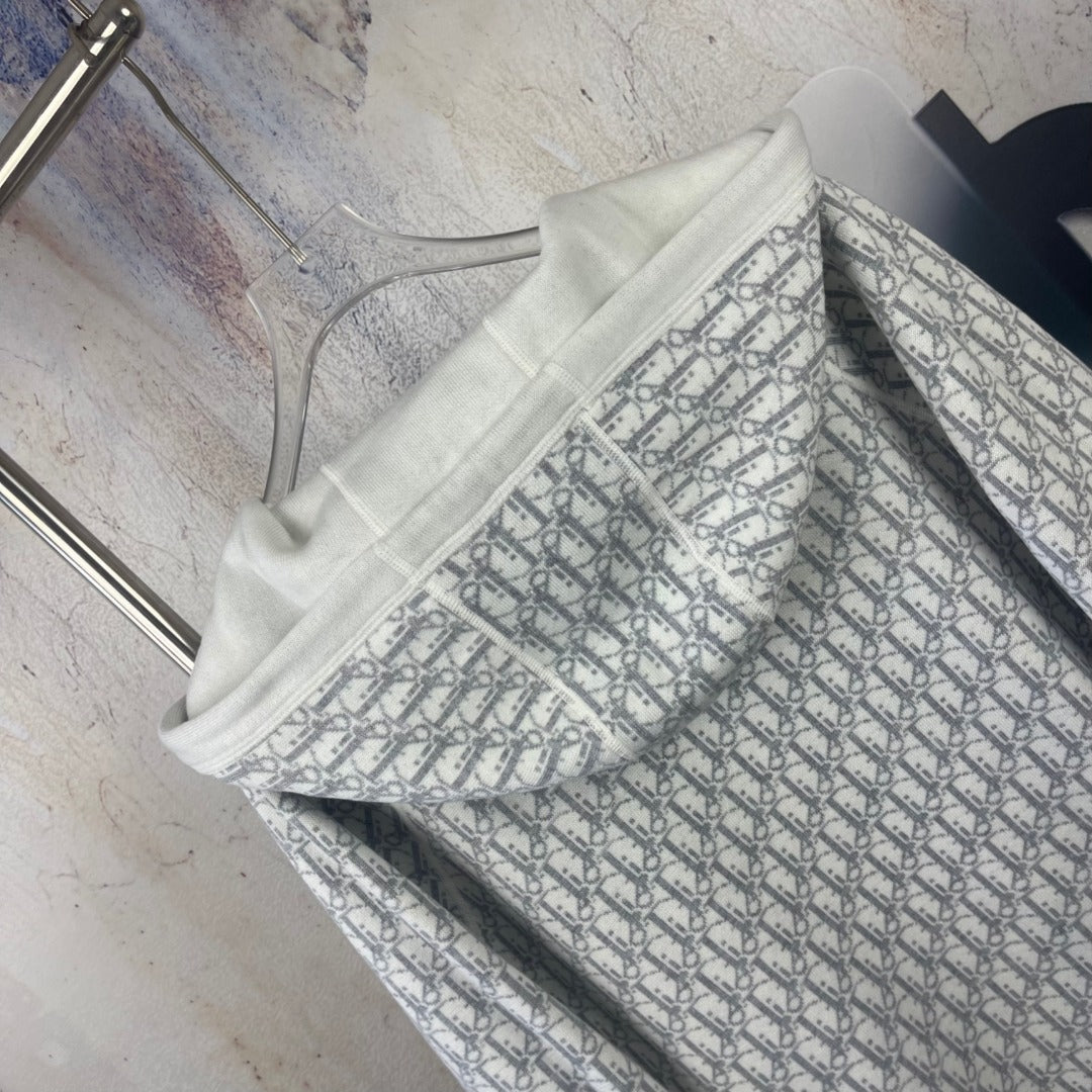 Dior long hoodie close-up with off-white hood and patterned inner lining