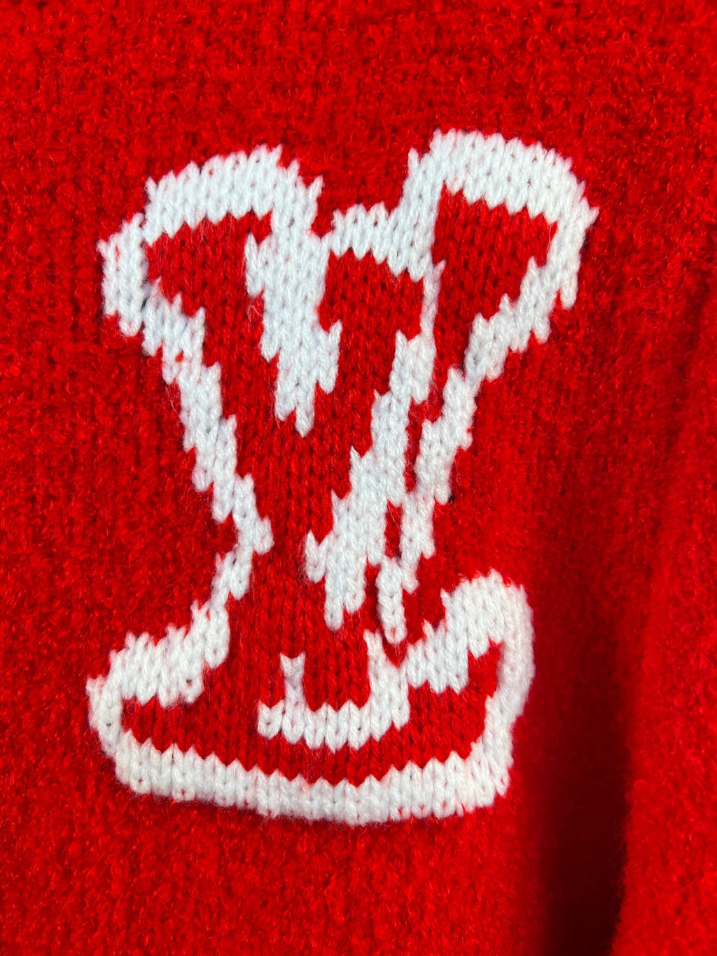 Red knit cardigan with large white heart LV-style logo