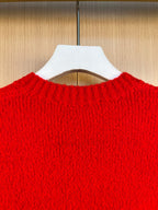 Red knit cardigan back collar and upper yoke texture