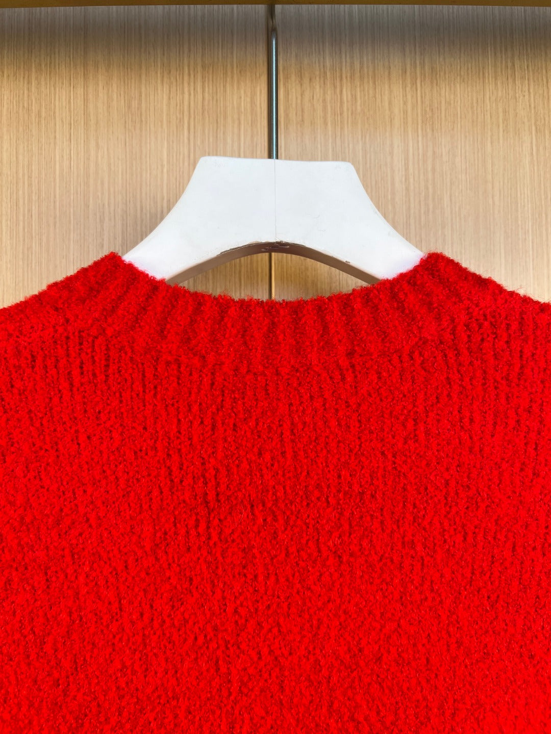 Red knit cardigan back collar and upper yoke texture