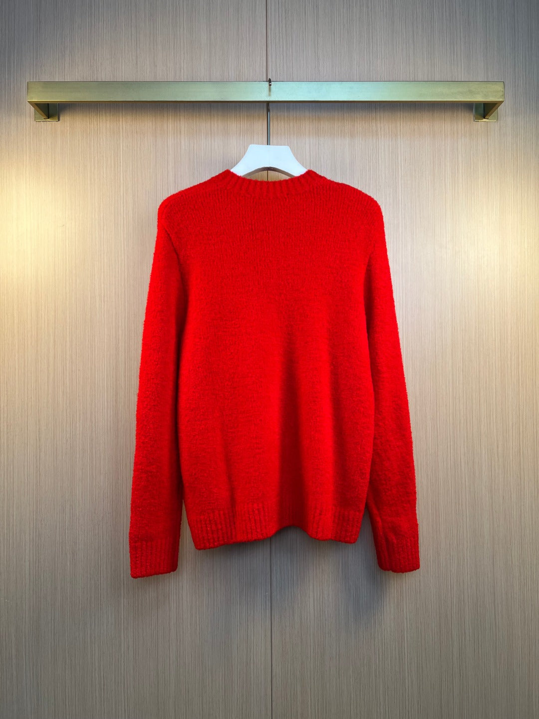 Red knit sweater cardigan back view with ribbed crew collar
