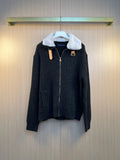 Dark knit jacket with faux fur collar, front zipper, and gold-tone logo hardware