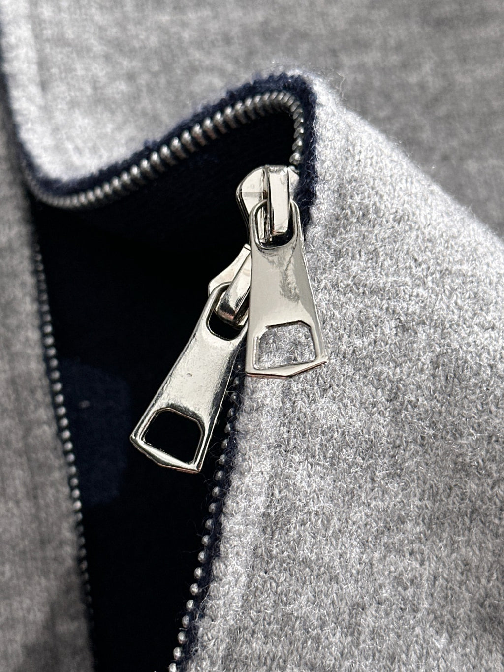 Dior long zip-up hoodie front zipper and logo patch on heather gray knit