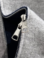 Dior long zip-up hoodie front zipper and logo patch on heather gray knit