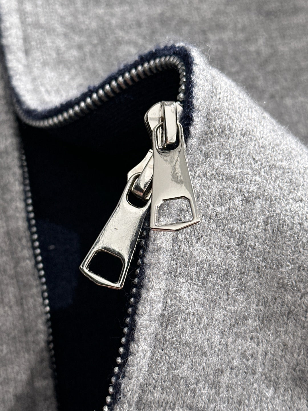 Dior long zip-up hoodie front zipper and logo patch on heather gray knit
