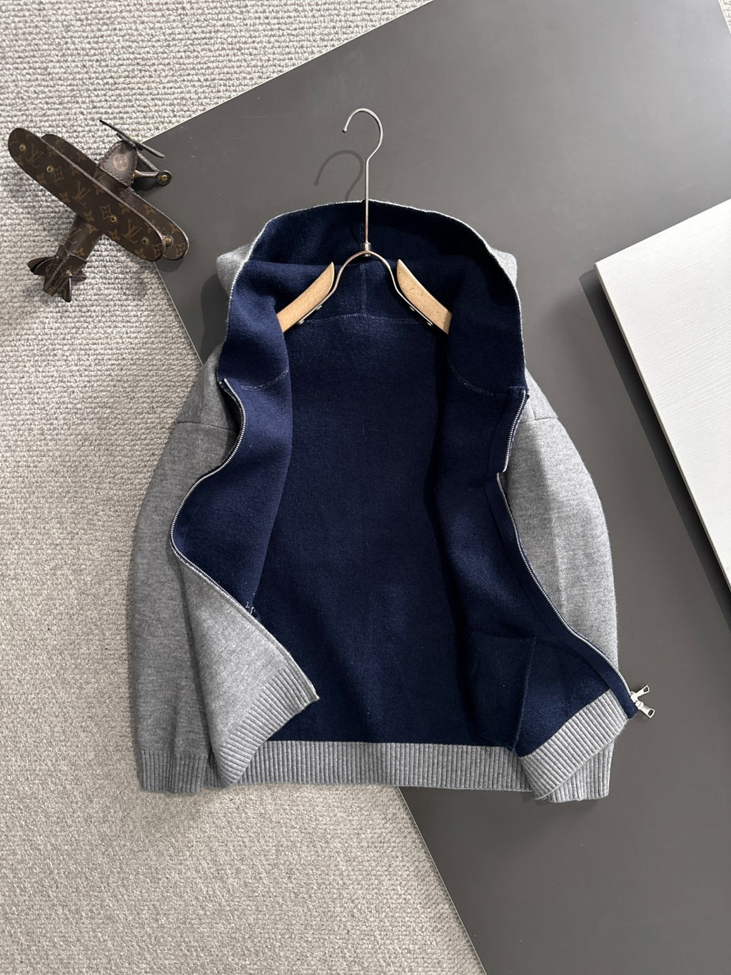 Dior long zip-up hoodie with navy interior hood lining and heather gray exterior