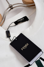 White Fendi T-shirt with neck label and black FENDI hang tag
