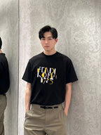 Fendi black short-sleeve T-shirt worn by model, FENDI ROMA 1975 front graphic