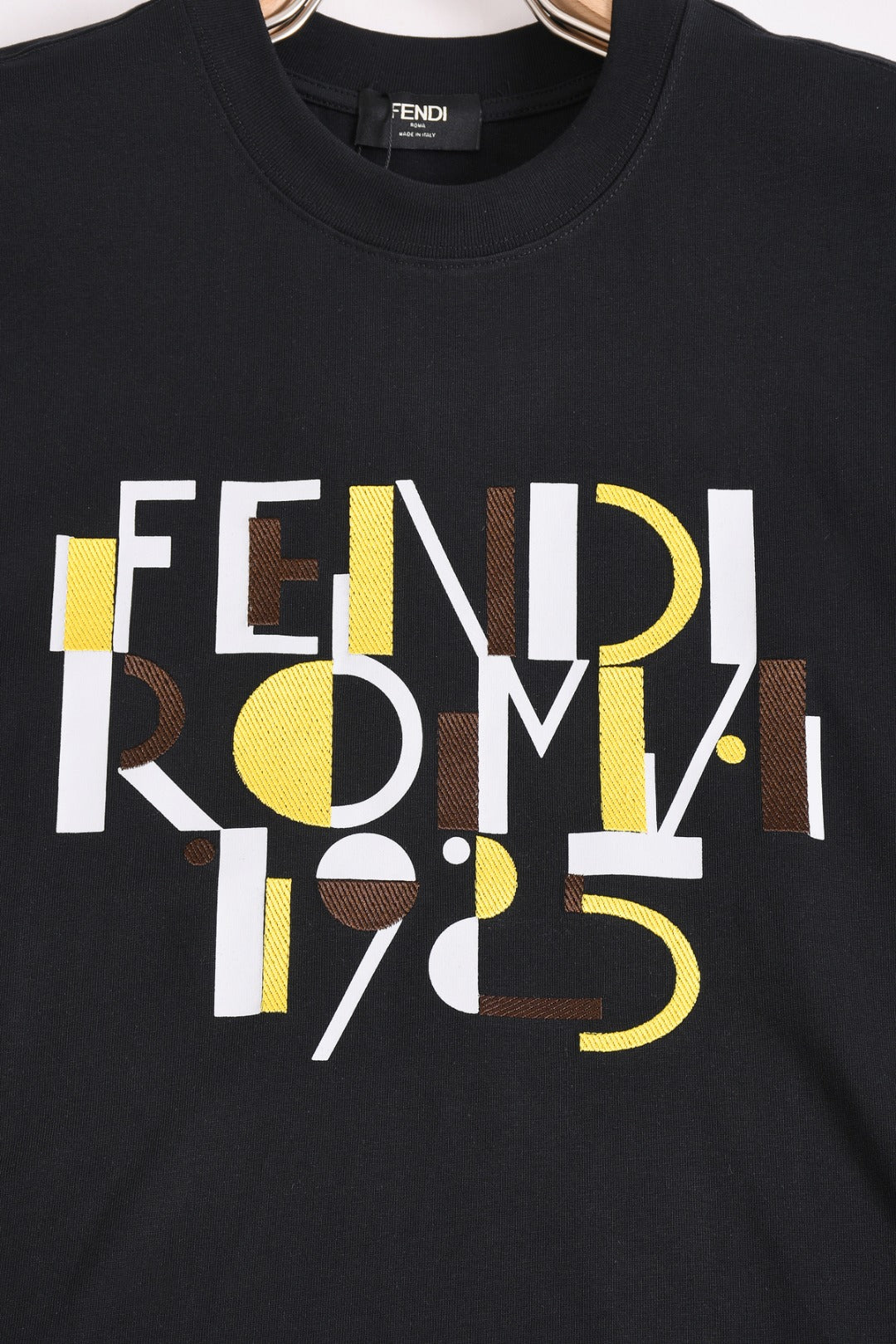 Fendi black short-sleeve T-shirt close-up of FENDI ROMA 1975 front graphic