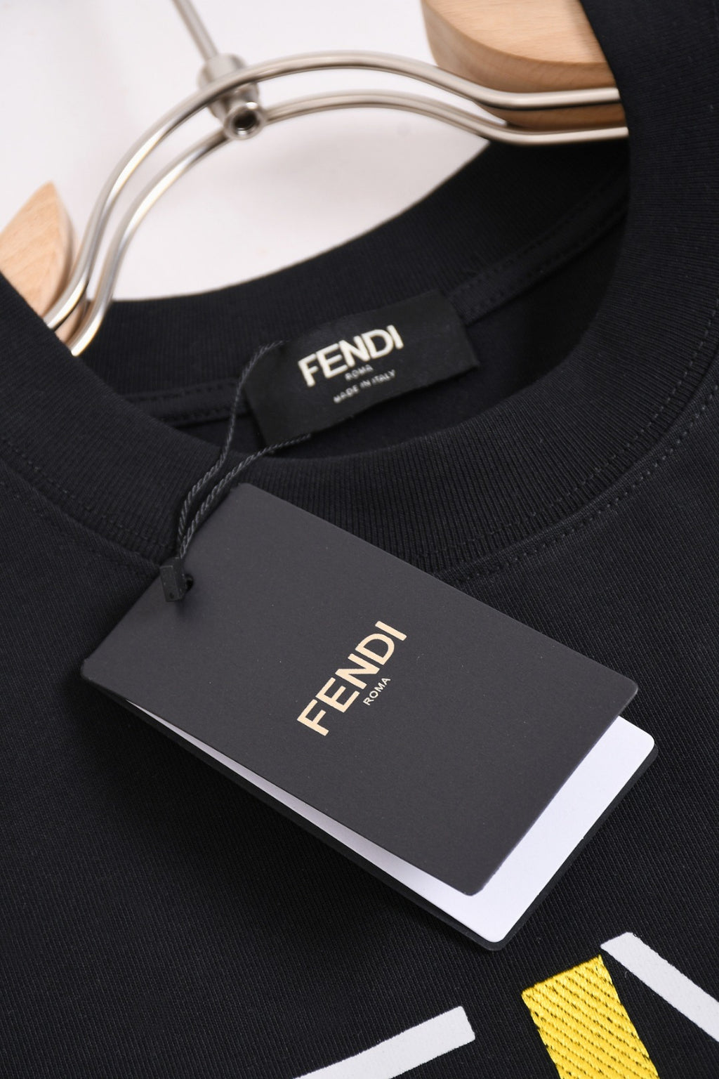 Fendi black crew-neck T-shirt with FENDI neck label and hanging size tag