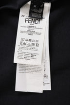 Fendi clothing label on dark top