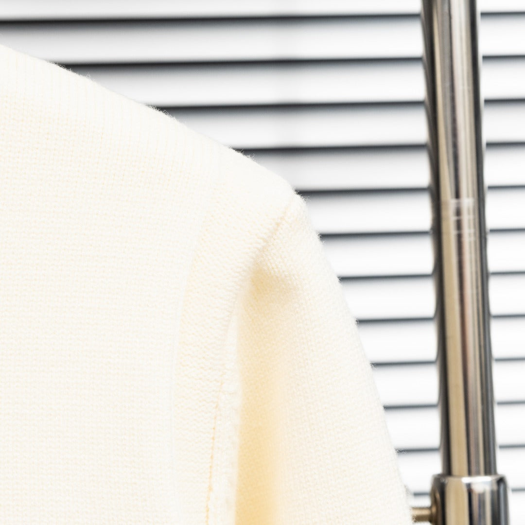 Stone Island cream knit cardigan sleeve cuff and shoulder seam detail
