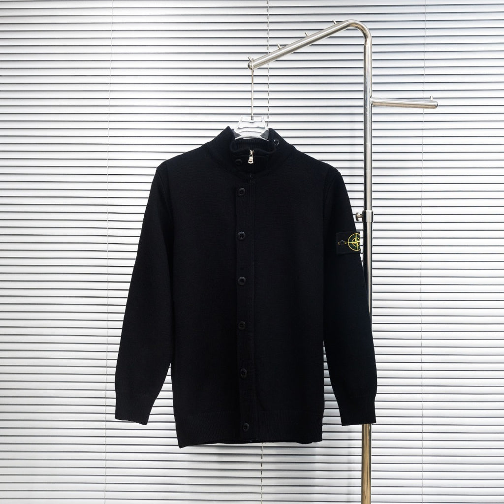 Black knit button-up jacket with high collar on hanger