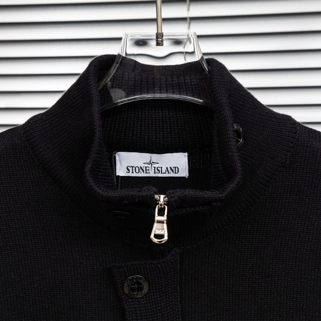 Black knit jacket collar with Stone Island label and zipper pull