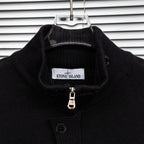 Black knit jacket collar with Stone Island label and zipper pull