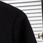 Black knit jacket sleeve with textured knit panel