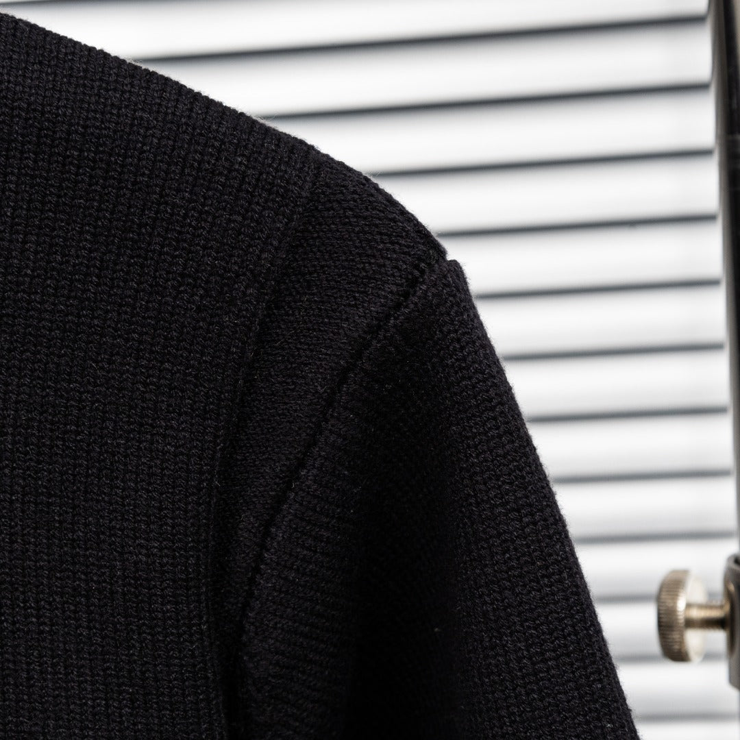 Black knit jacket sleeve with textured knit panel