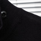Black knit jacket shoulder with logo button detail