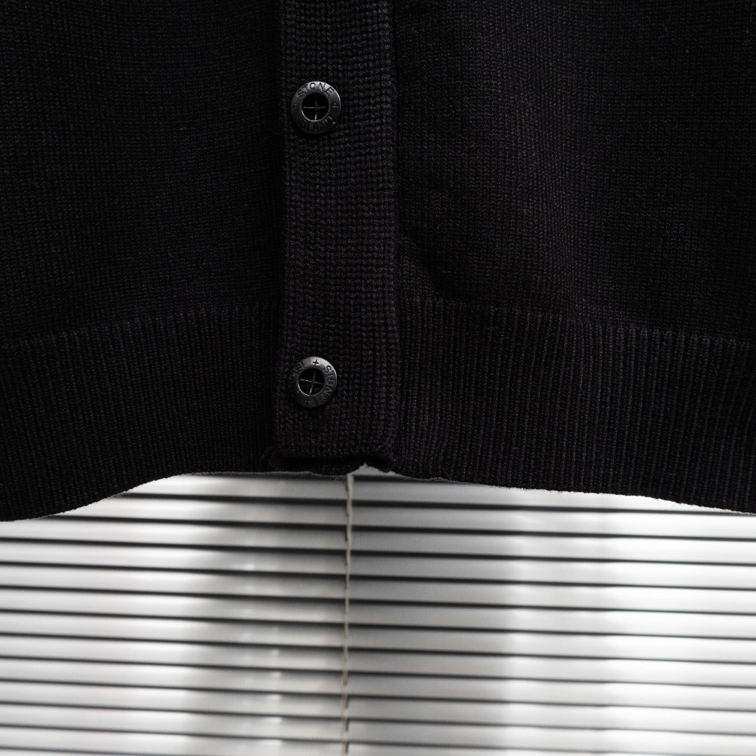 Black knit jacket front placket with dark buttons