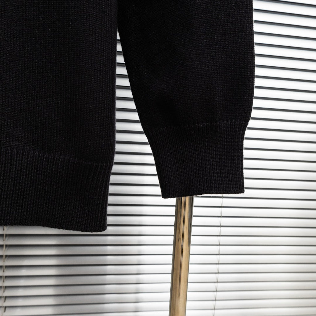 Black knit jacket sleeve hem with ribbed cuff