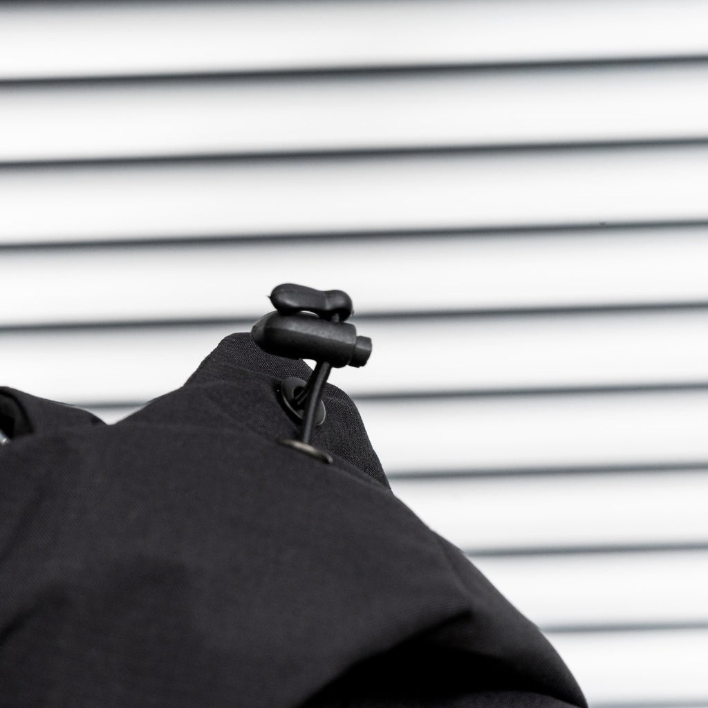Stone Island hood detail with black toggle and front fabric seam