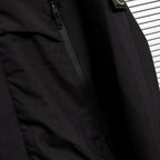 Stone Island jacket front with zipper and stitched placket in dark fabric