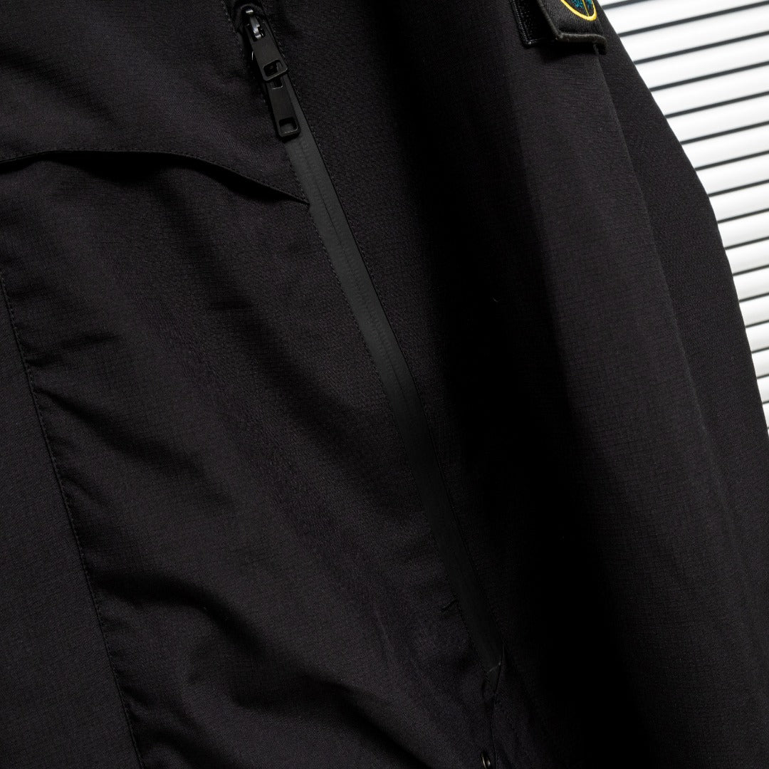 Stone Island jacket front with zipper and stitched placket in dark fabric