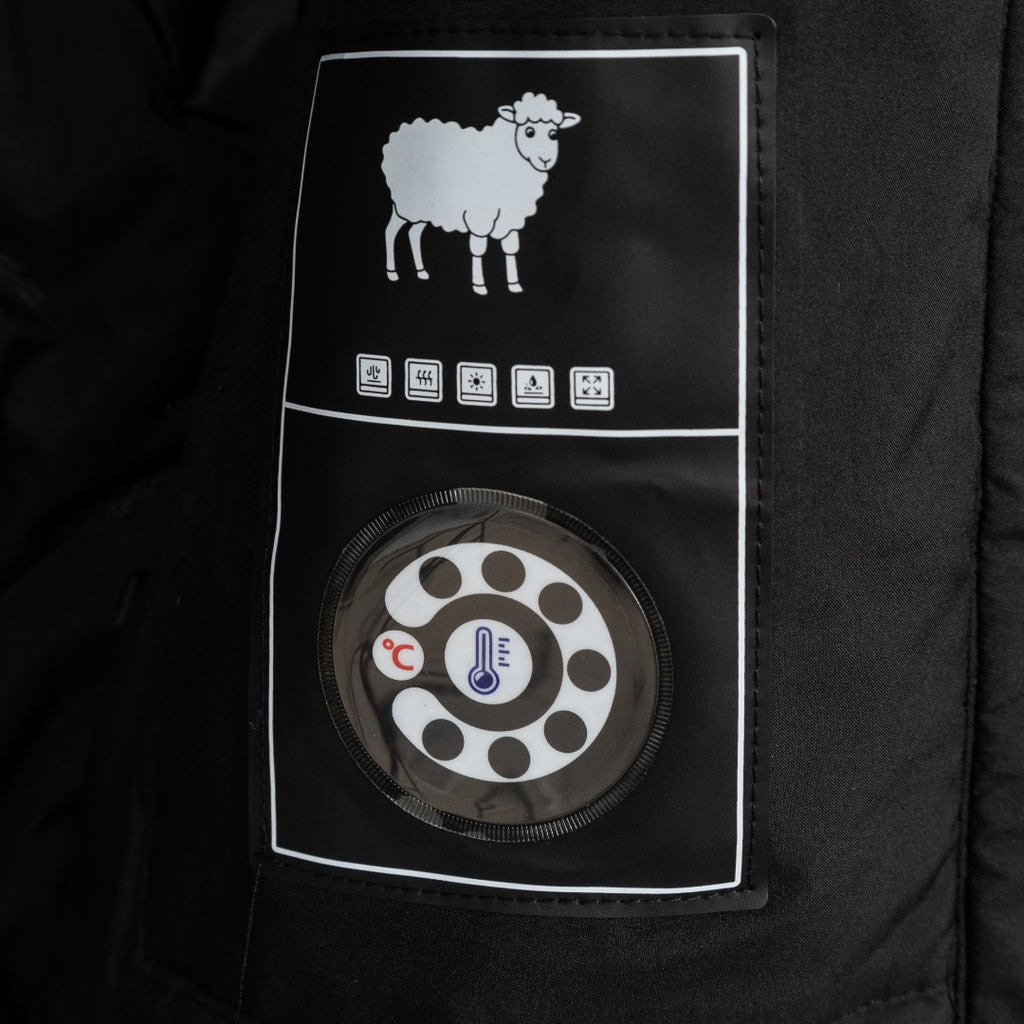 Stone Island jacket inner care label with sheep icon and thermostat graphic