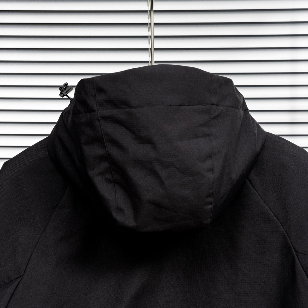 Stone Island black jacket back view with hood