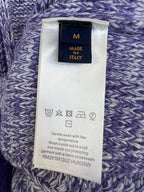 Louis Vuitton knit sweater care label on purple-and-blue marled knit