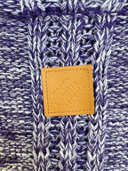 Louis Vuitton leather logo patch on blue-and-white marled knit sweater