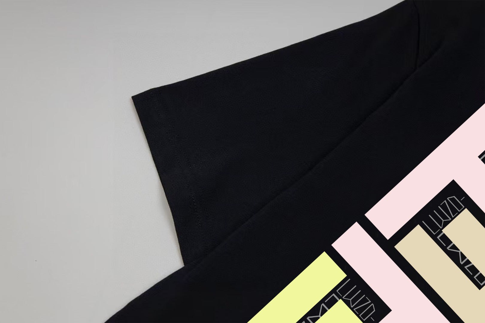 Black Fendi T-shirt sleeve with partial multicolor logo graphic