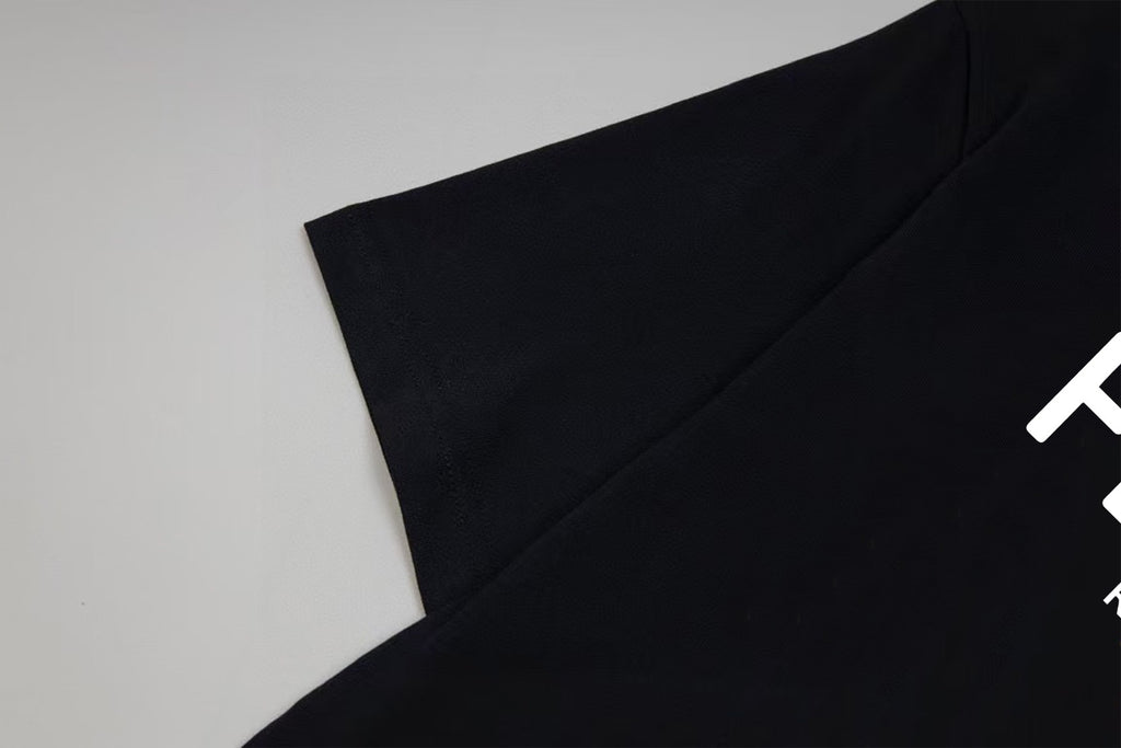 Black Fendi T-shirt sleeve and shoulder seam, angled view