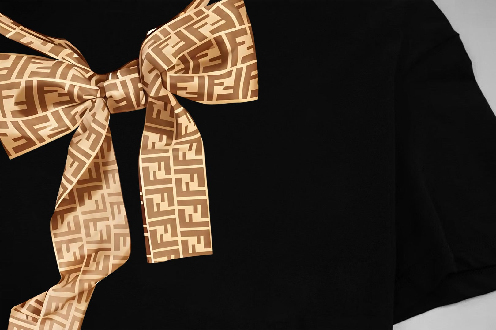 Black short-sleeve shirt with large gold Fendi monogram bow at neckline