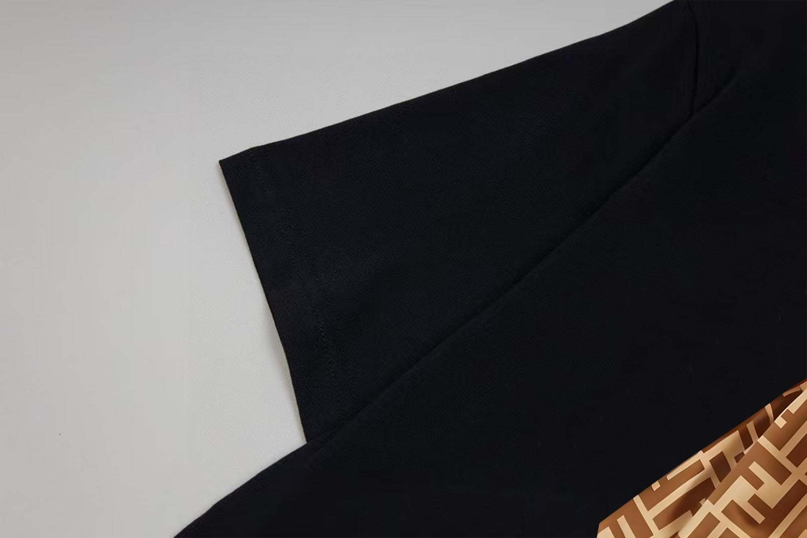 Black Fendi short-sleeve T-shirt sleeve and shoulder seam close-up