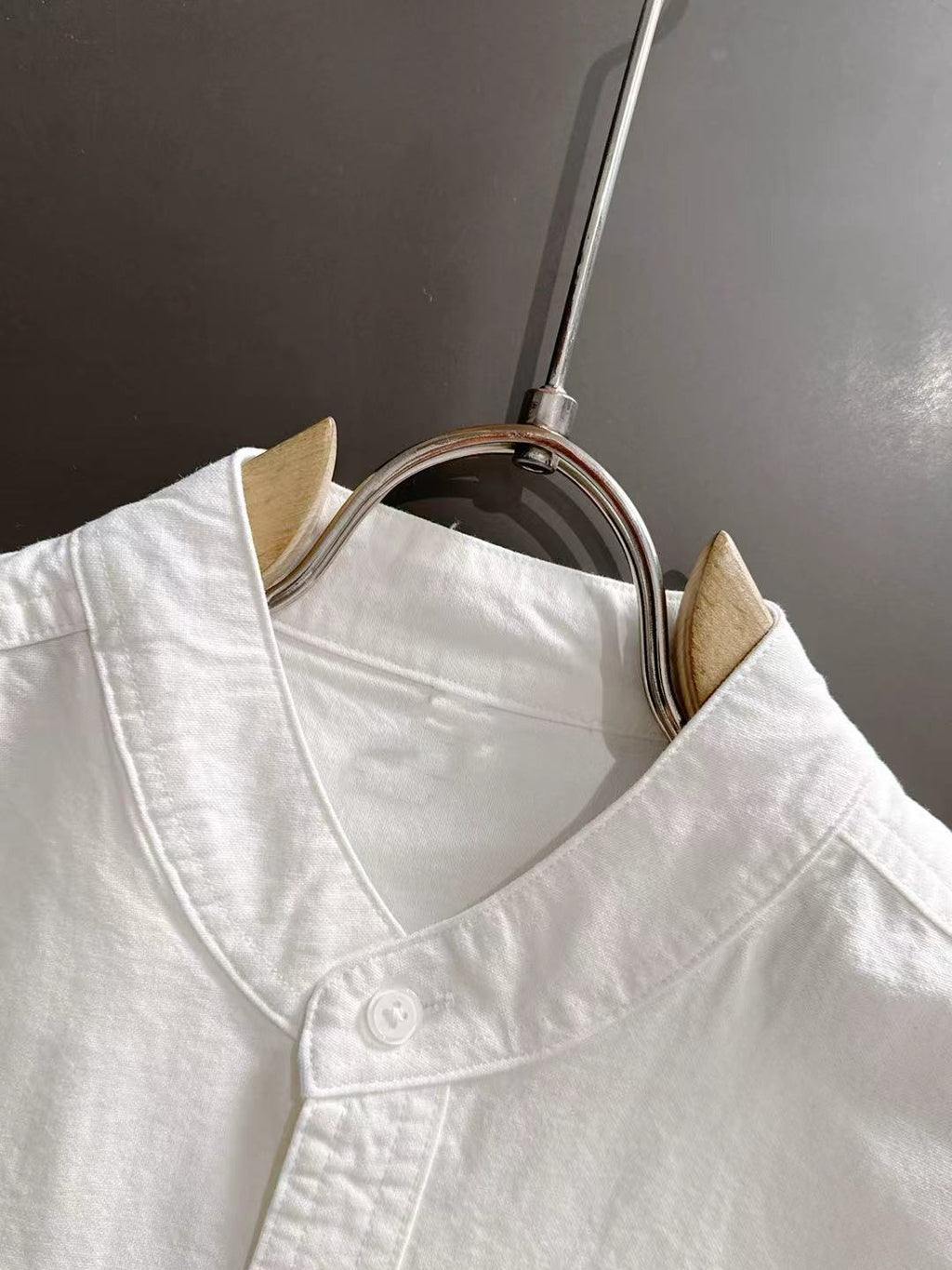 Dior long-sleeve shirt close-up, white stand collar and button placket