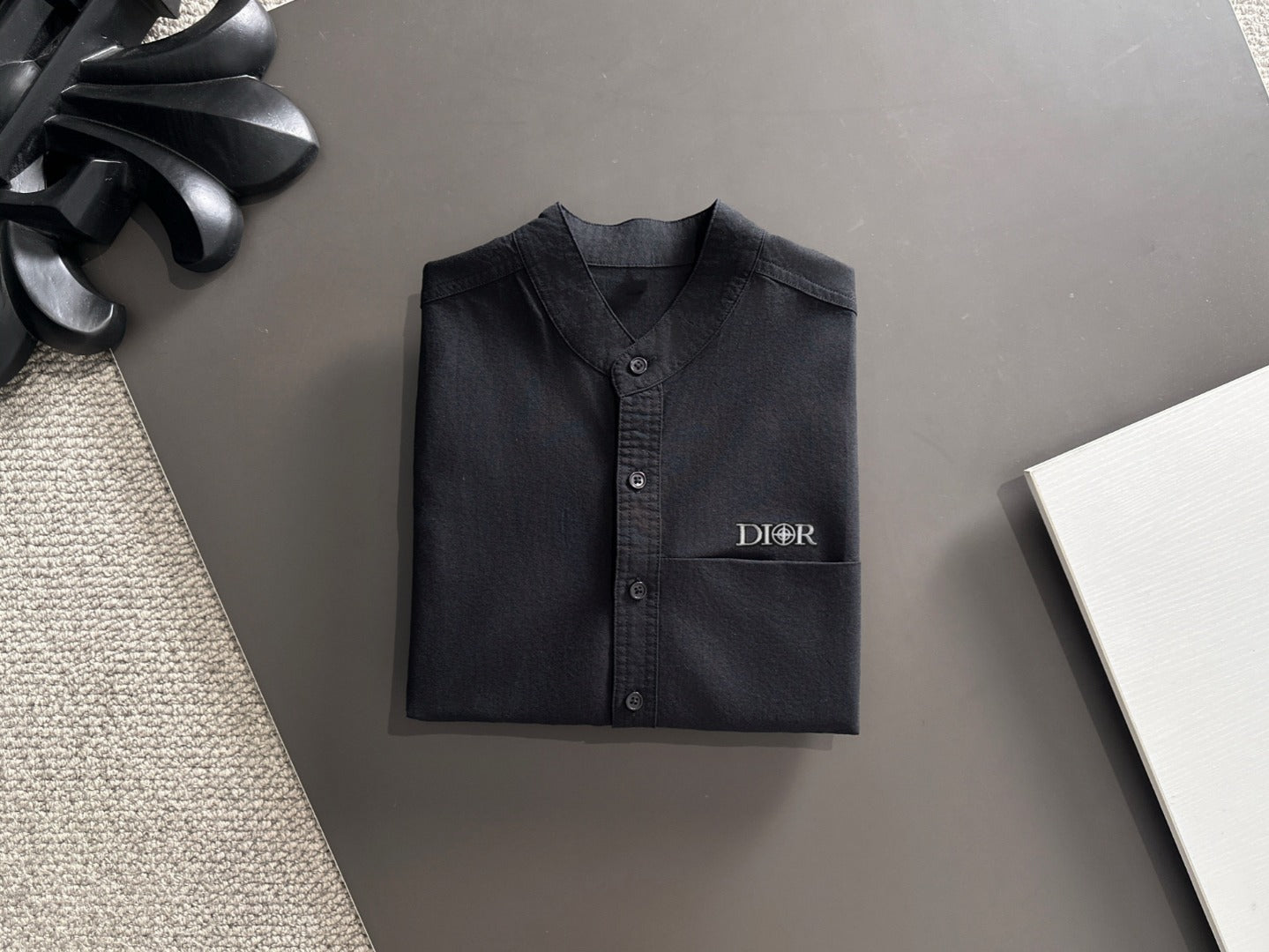 Dior long-sleeve button-up shirt, dark front with Dior logo and button placket