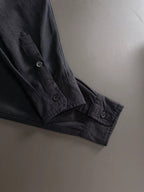 Dior long-sleeve shirt cuff with dark buttons and stitched hem