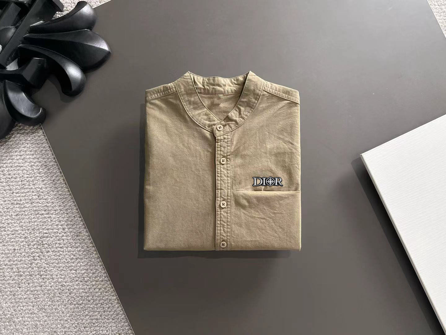 Long-sleeve button-up shirt with placket buttons and Dior chest logo, olive-brown.