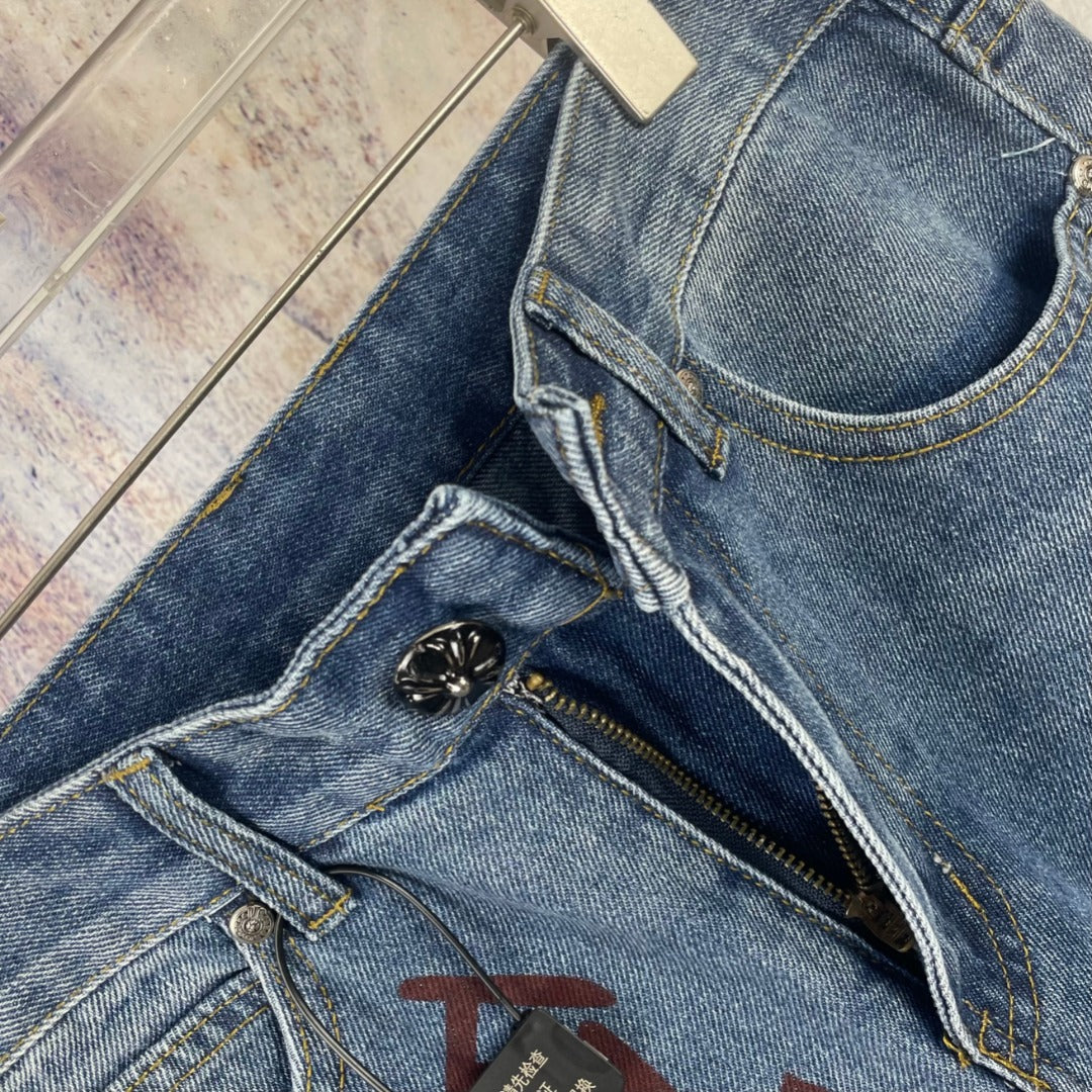 Light blue denim pants close-up of button fly, stitching, and black zipper pull