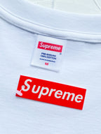 White T-shirt neckline label and red Supreme logo tag