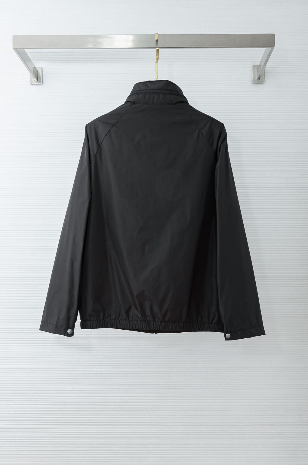 Prada long jacket back view with stand collar and snap-button hem