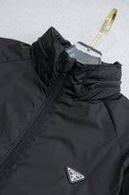 Prada long jacket with hooded stand collar, front zipper, and Prada triangle badge
