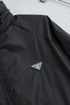 Prada long jacket sleeve with embroidered Prada triangle logo badge